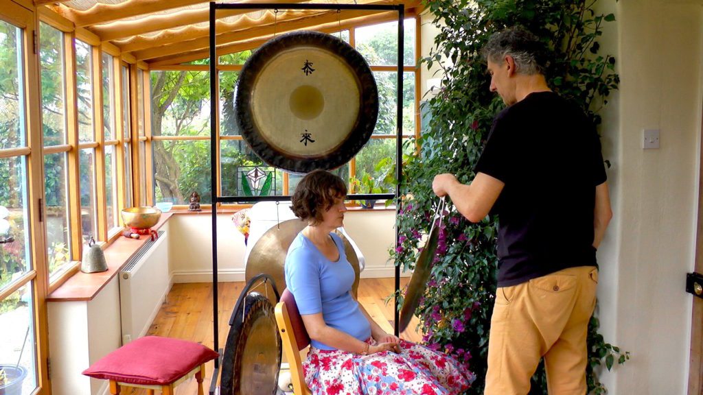 sound healing with gong client sitting